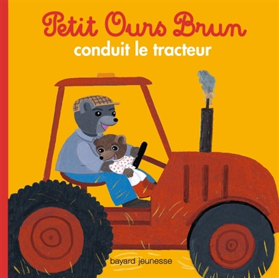 Petit ours brun conduit le tracteur